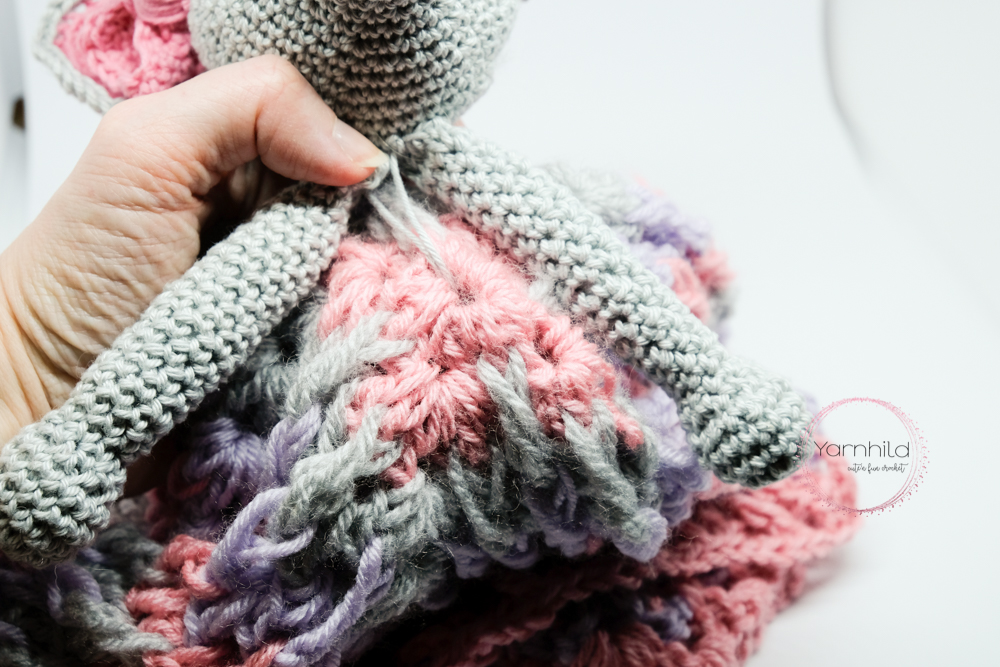 Sew on the head on the middle of the granny square.